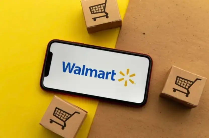 Walmart logo on phone with cardboard boxes